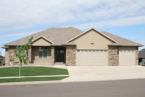 a Lewisville home with a well maintained yard